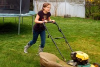 Elisa cutting the lawn